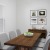 a dining table with a bowl of fruit on it