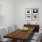 a dining table with a bowl of fruit on it
