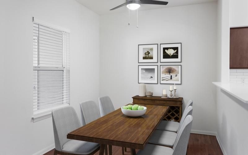 a dining table with a bowl of fruit on it