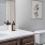 a bathroom with a sink toilet and mirror