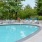 a pool with chairs around it