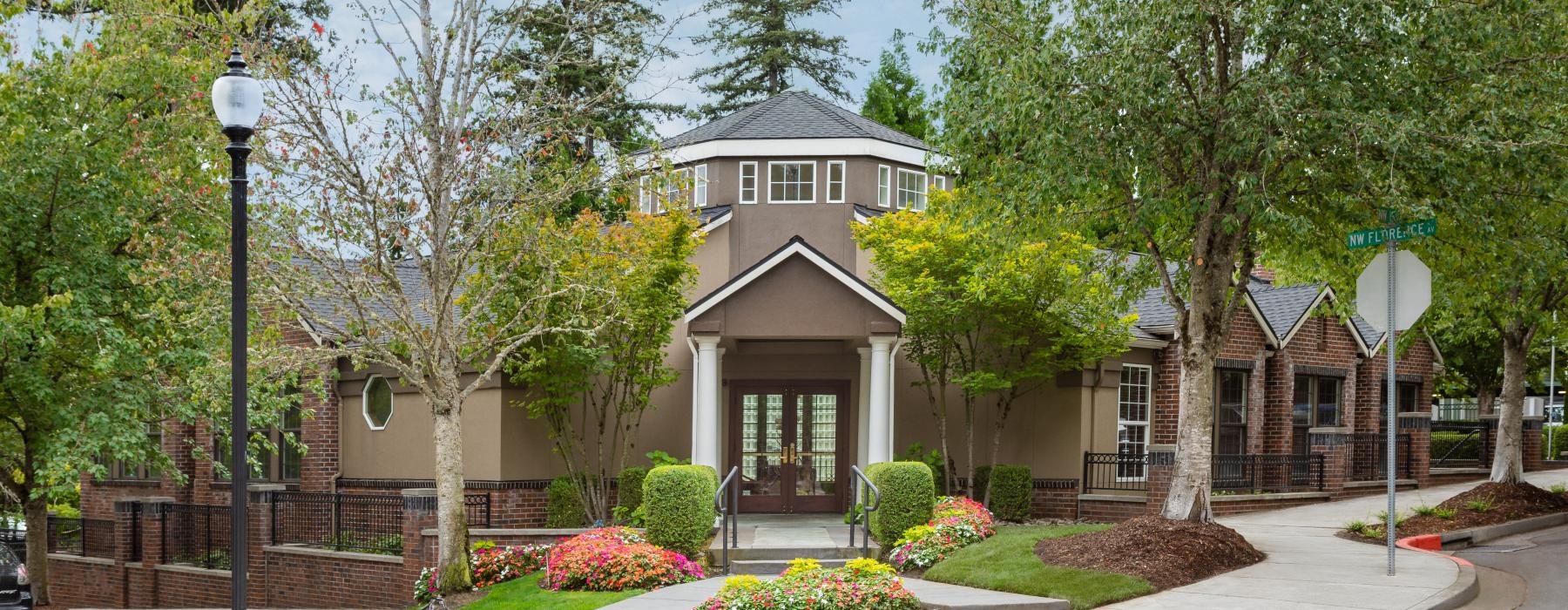 a house with trees and bushes around it