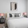 a bedroom with a bed and lamps