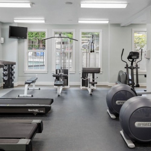 Cutting-edge amenities at your fingertips a gym with exercise equipment
