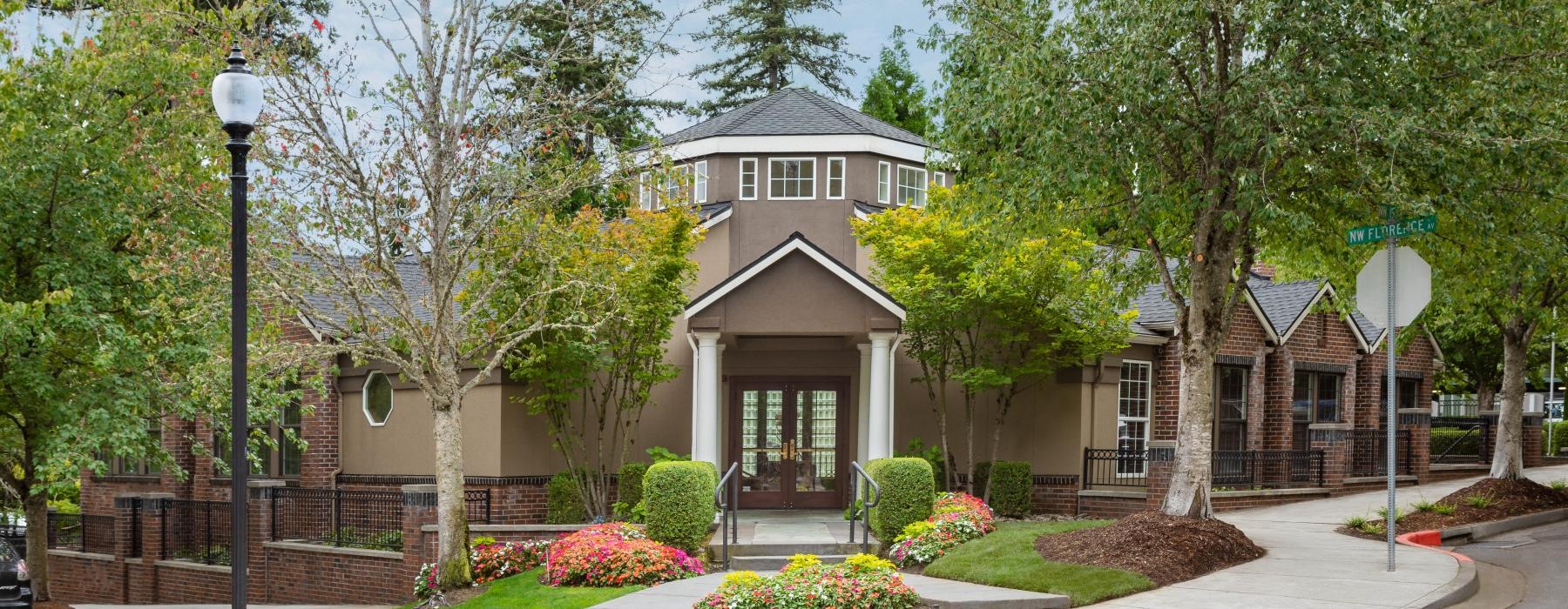 a house with trees and bushes around it