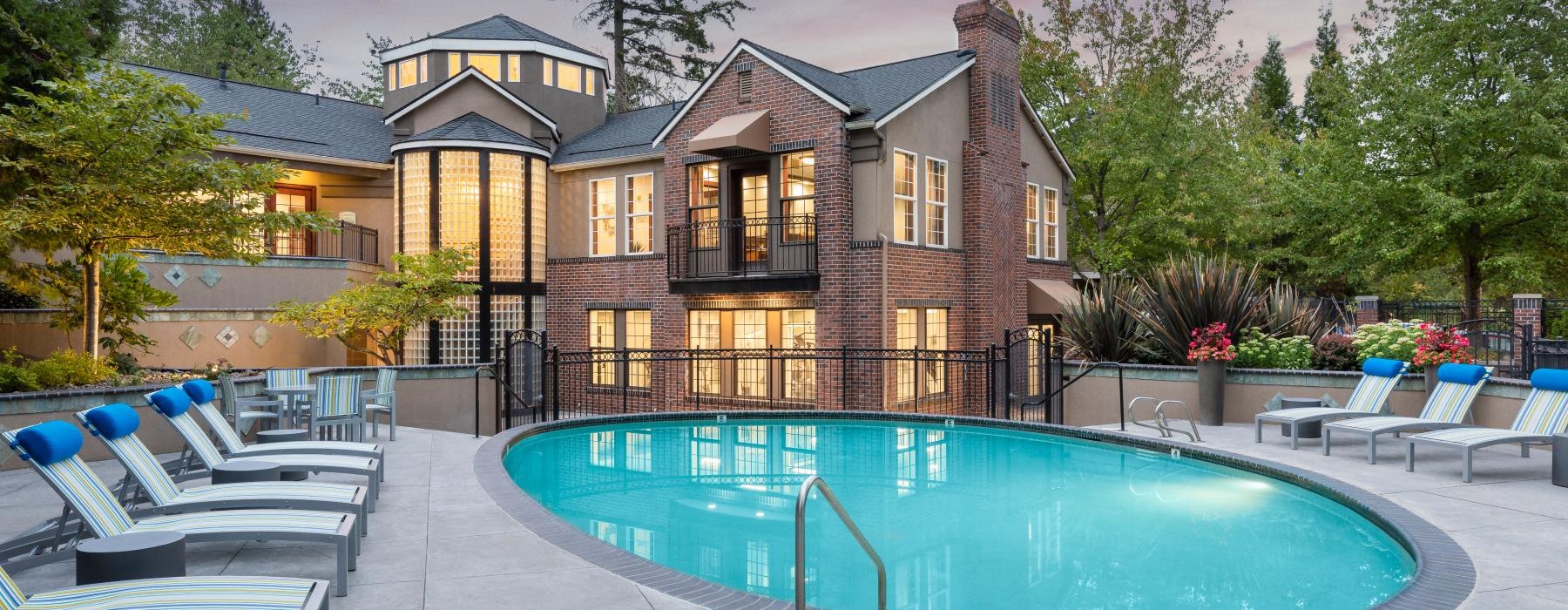 a swimming pool in front of a house
