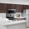 a kitchen with wooden cabinets