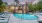 a swimming pool in front of a house