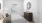 a bedroom with a bed and a mirror