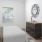 a bedroom with a bed and a mirror